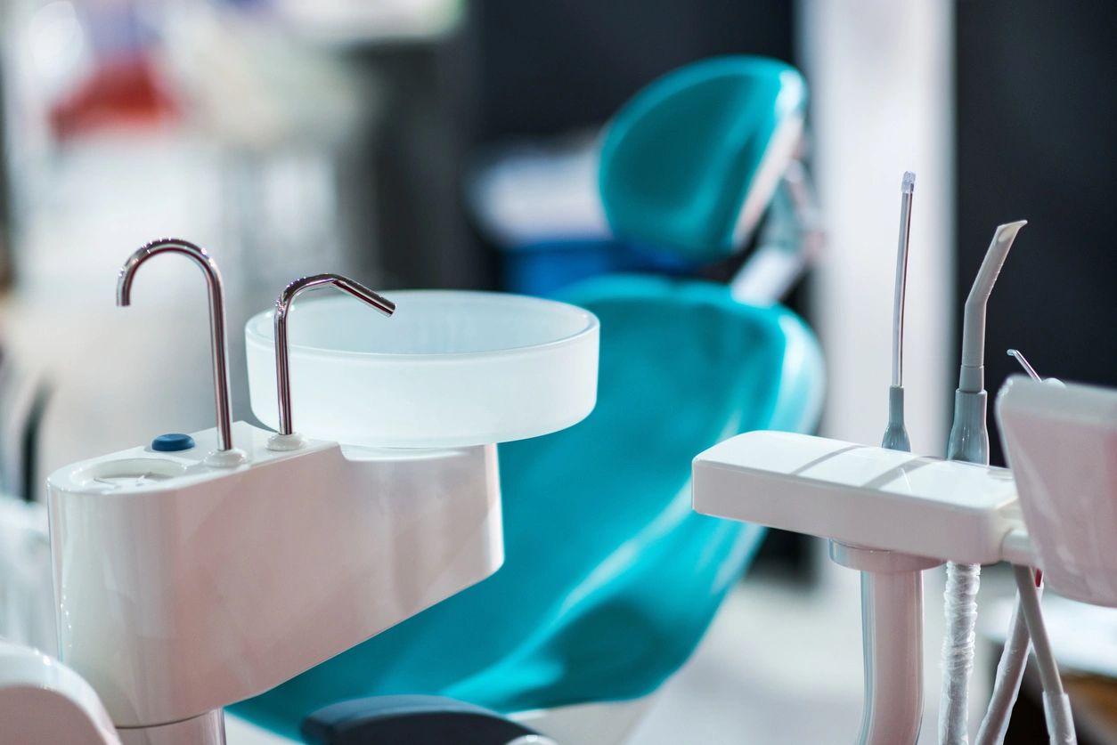 Modern dental treatment room with chair and professional equipment